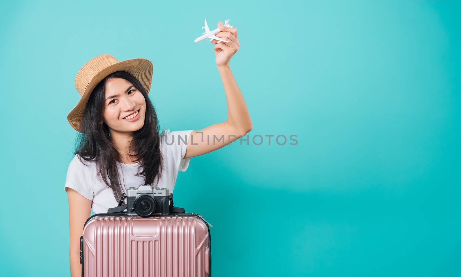 woman, holidays travel concept, her holding fly toy aircraft her by Sorapop