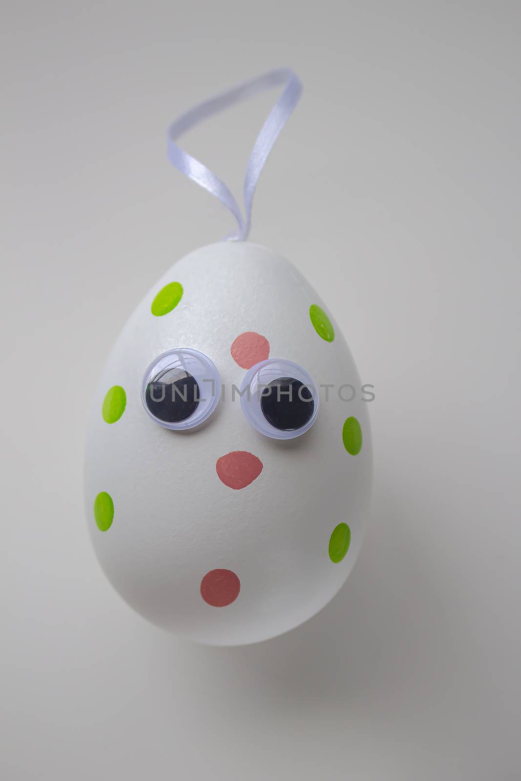 An Easter Egg with a hanger on a white background by oasisamuel