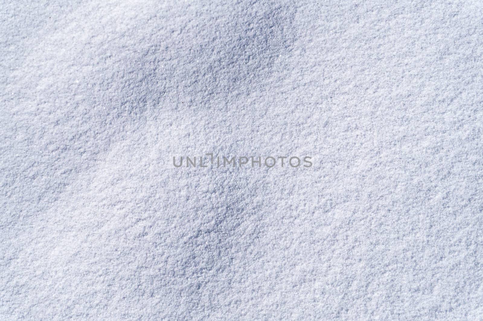 Photography of beautiful pure white snow texture. White snowflakes background rough pattern of snow texture. Winter. Mountain.