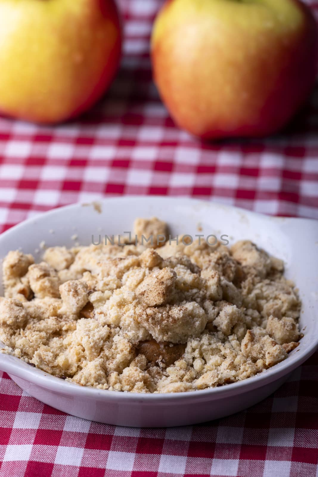 closeup of a portion of apple crumble by bernjuer