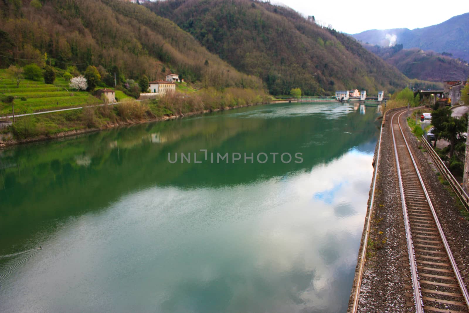 The Tuscan Serchio river in Borgo a Mozzano and the reflection of the sky on a cloudy day by alessiapenny90