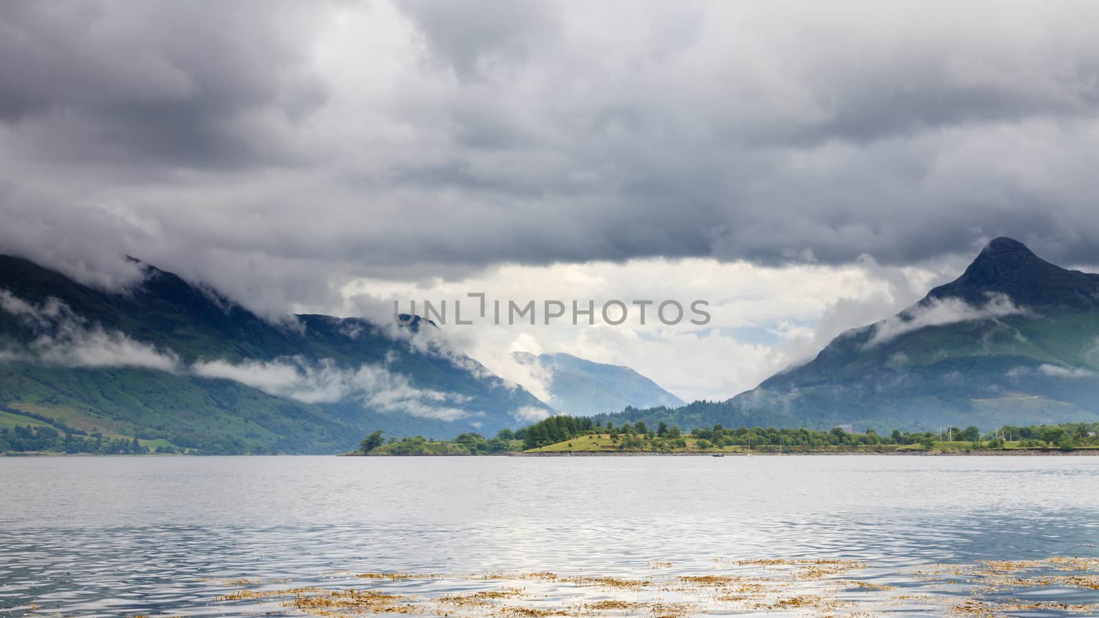 The view across Loch Leven to the Pap of Glencoe in the Scottish highlands.  Loch Leven is a sea loch on the west coast of Scotland.