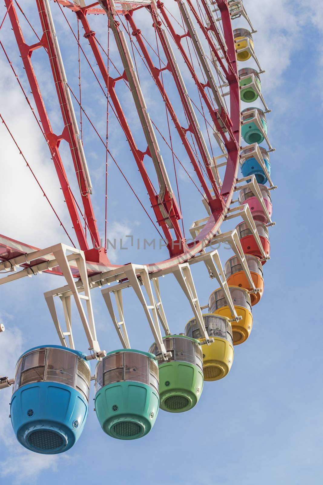 Odaiba colorful tall Palette Town Ferris wheel named Daikanransha visible from the central urban area of Tokyo. Passengers can see the Tokyo Tower, the twin-deck Rainbow Bridge, and Haneda Airport, as well as central Tokyo during their ride.