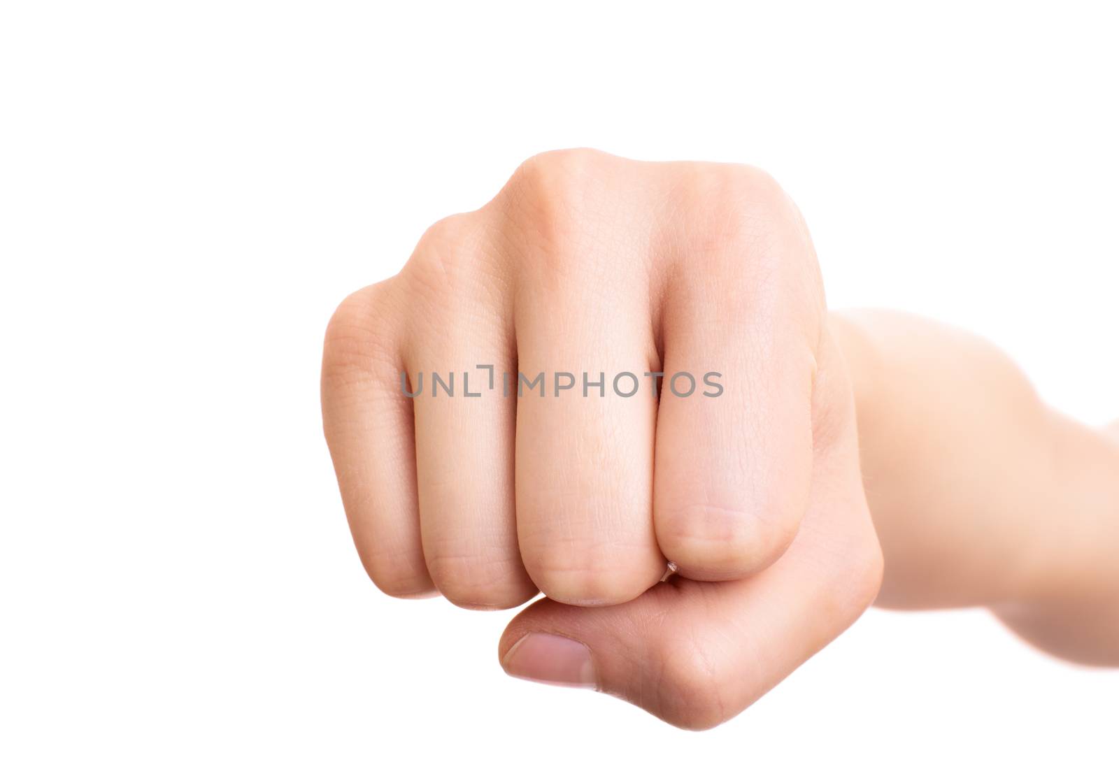 Close up of a female fist punching the camera, isolated on white background. Front view.