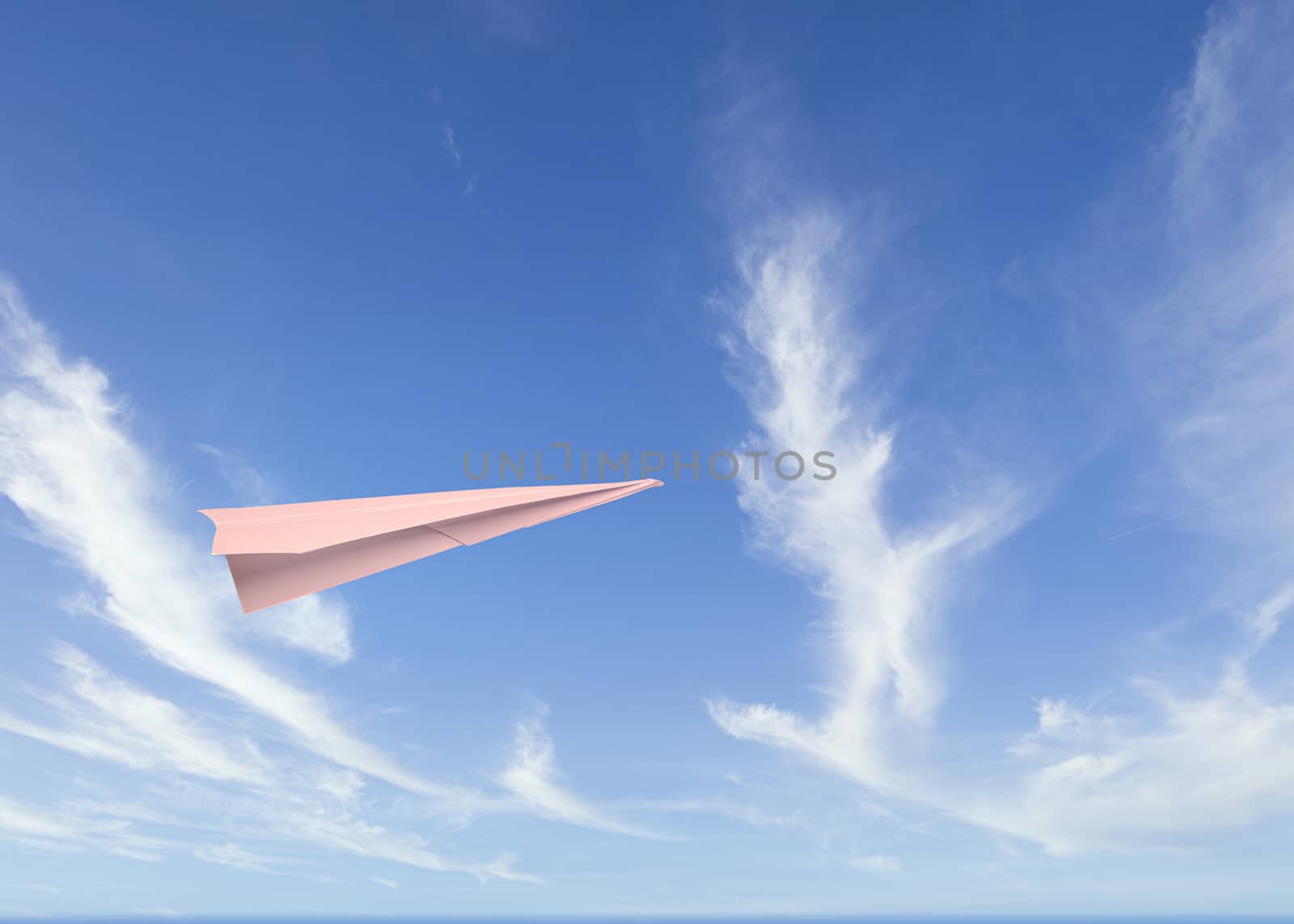 a paper plane flies in a cloudy sky