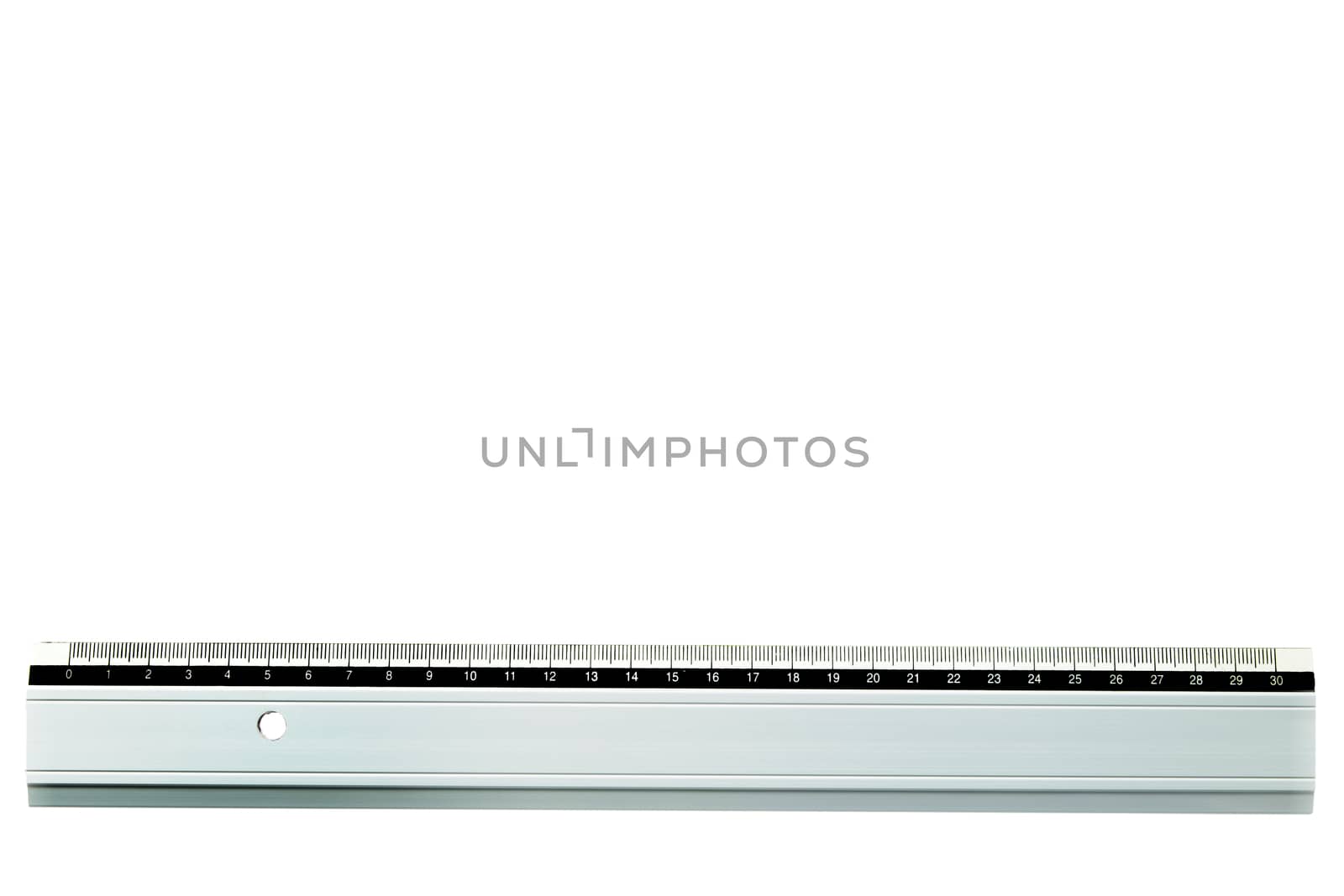 ruler laying straight at bottom of a white page with copy space