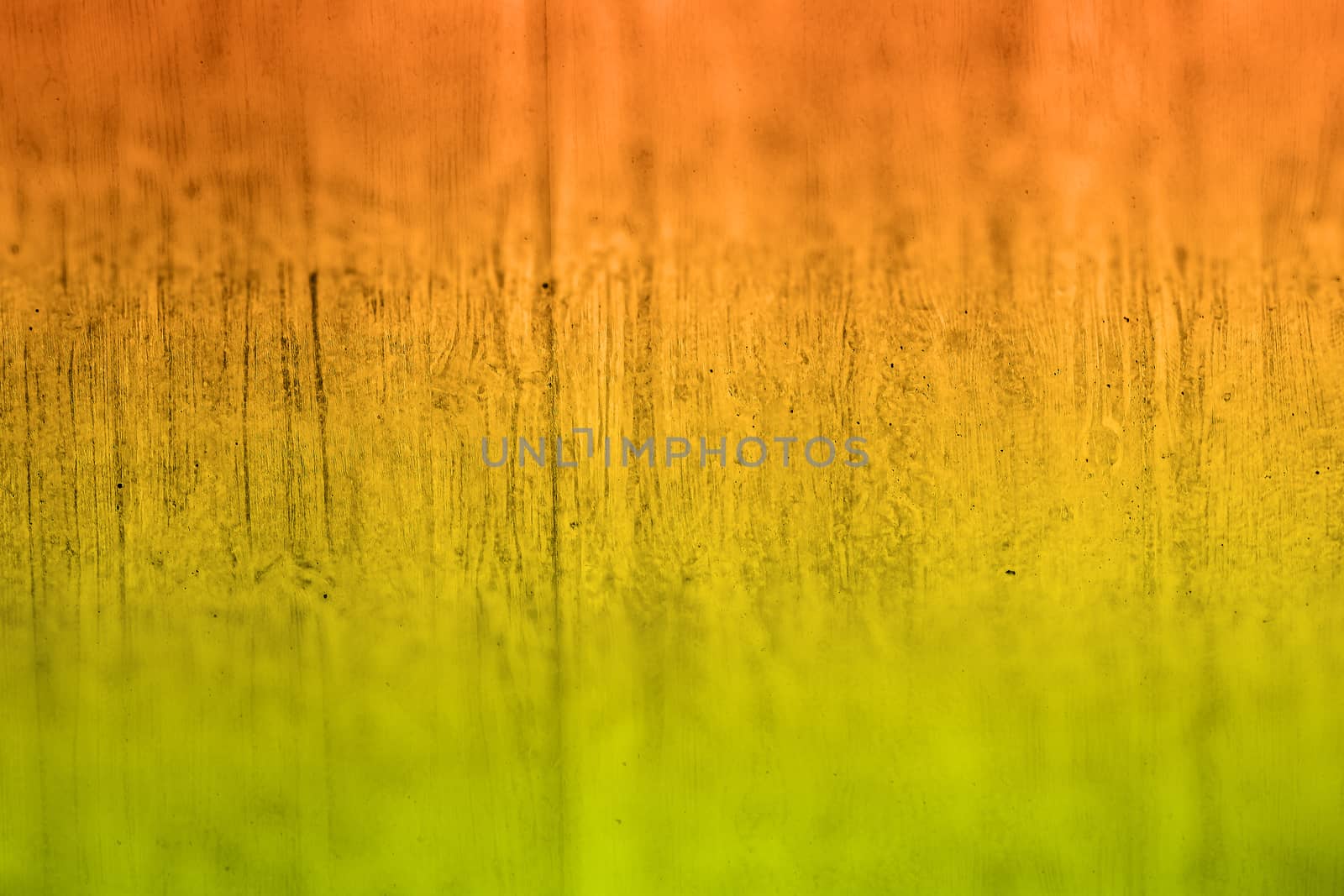 cement wall with copy space for background, colored in in green, yellow, orange