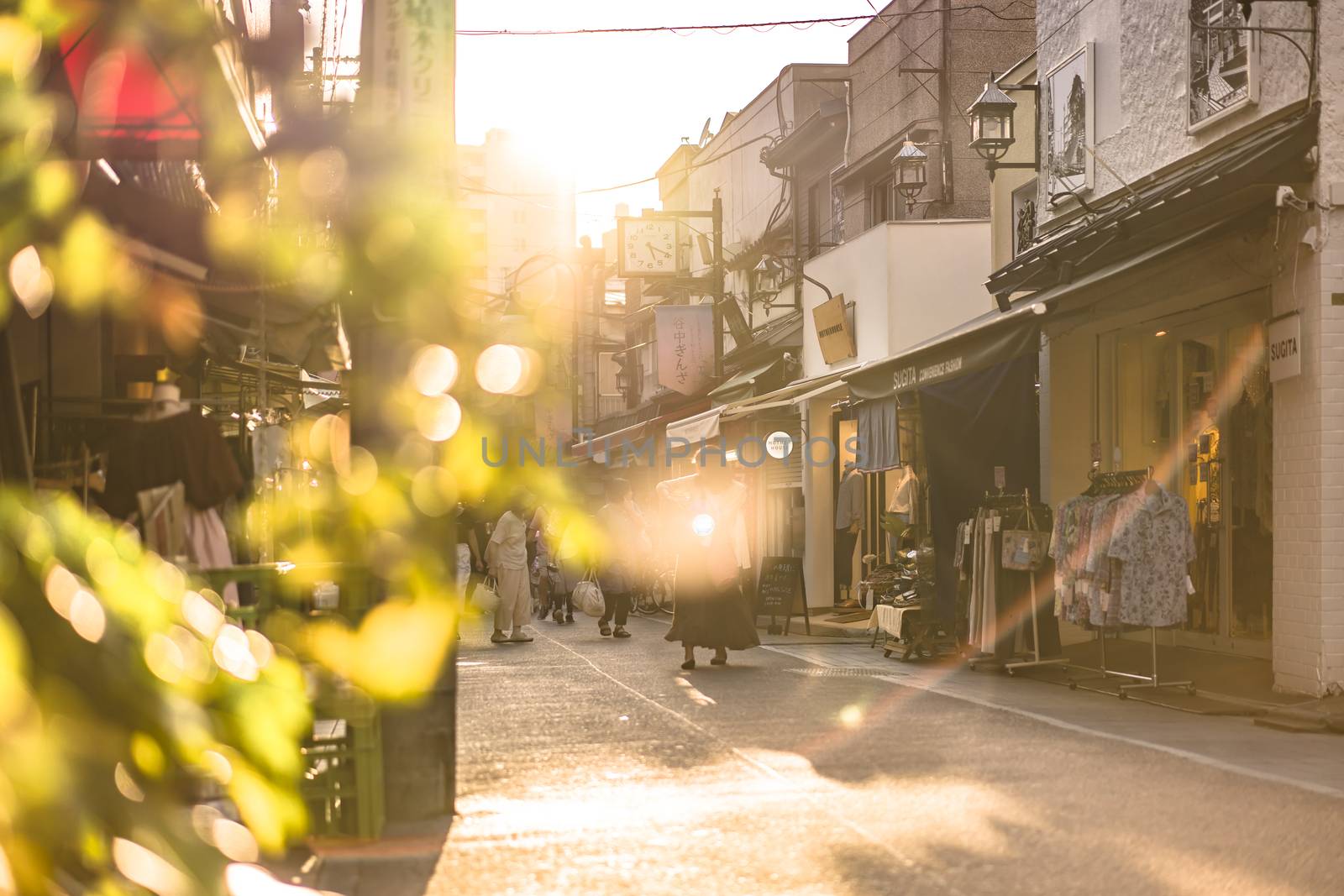 Old-fashionned shopping street Yanaka Ginza famous as a spectacular spot for sunset golden hour from the Yuyakedandan stairs which means Dusk Steps at Nishi-Nippori in Tokyo. Yanaka Ginza is also named the Evening Village.