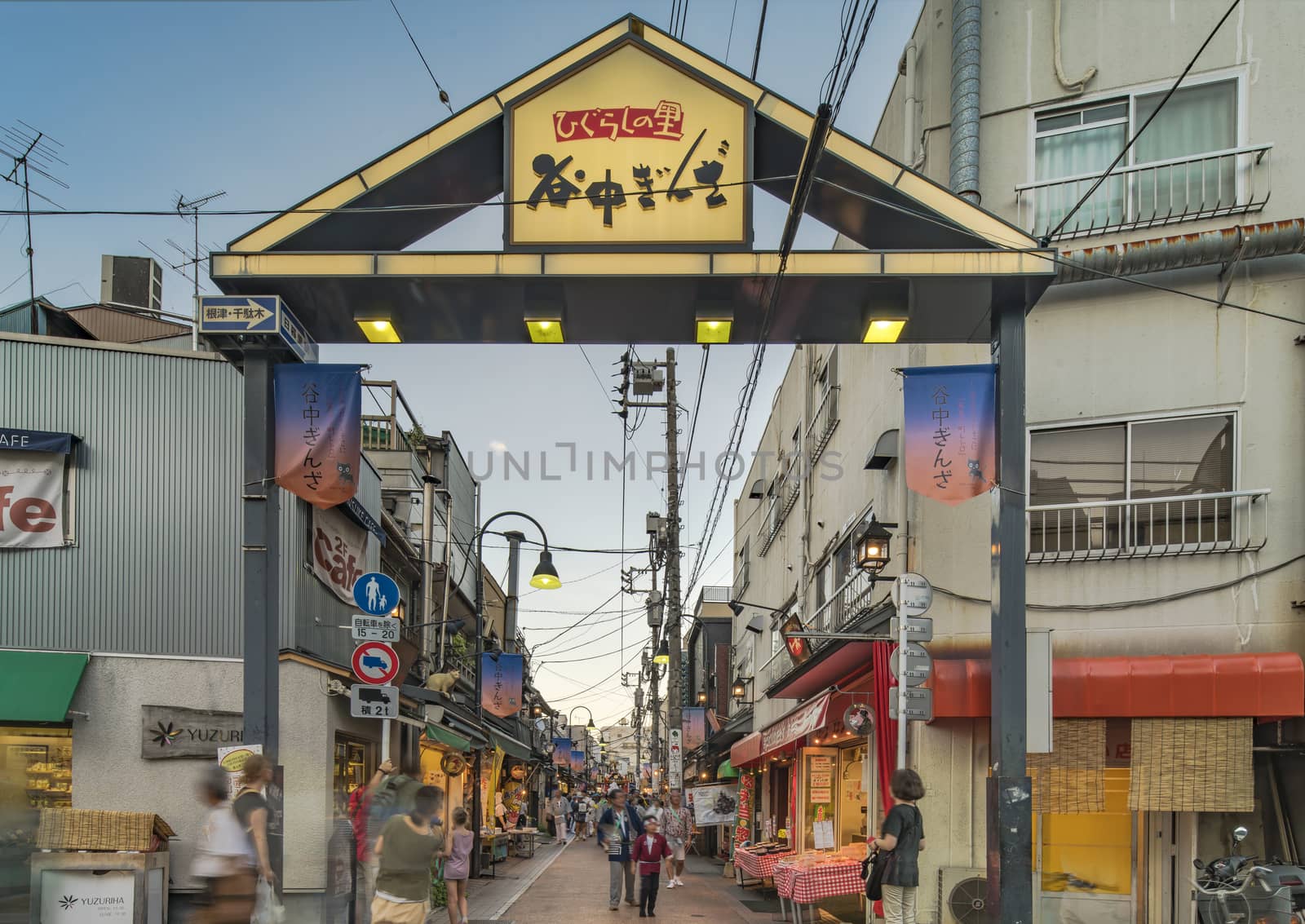 Retro old-fashionned shopping street Yanaka Ginza famous as a spectacular spot for sunset golden hour from the Yuyakedandan stairs which means Dusk Steps at Nishi-Nippori in Tokyo. Yanaka Ginza is also named the Evening Village.