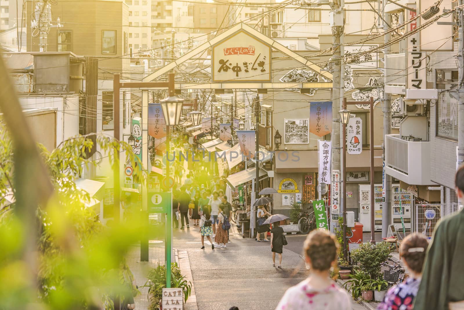 The famous Yuyakedandan stairs which means Dusk Steps at Nishi-Nippori in Tokyo. The landscape overlooking Yanaka Ginza from the top of the stairs is famous as a spectacular spot for sunset. Below the stairs there is a gate marked "Yanaka Ginza, the Evening Village".