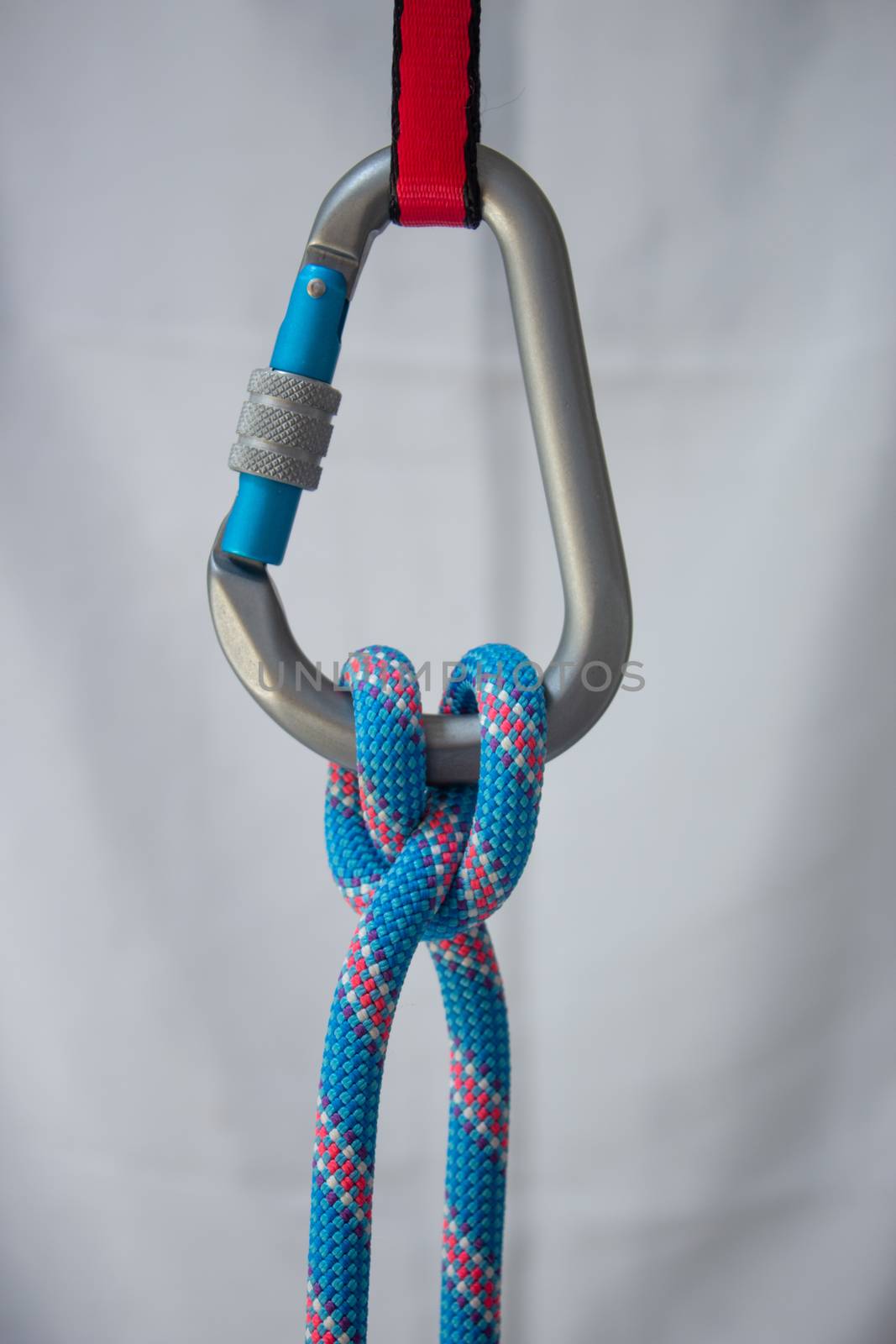 Clove hitch tied with a climbing rope to a pear shaped locking carabiner