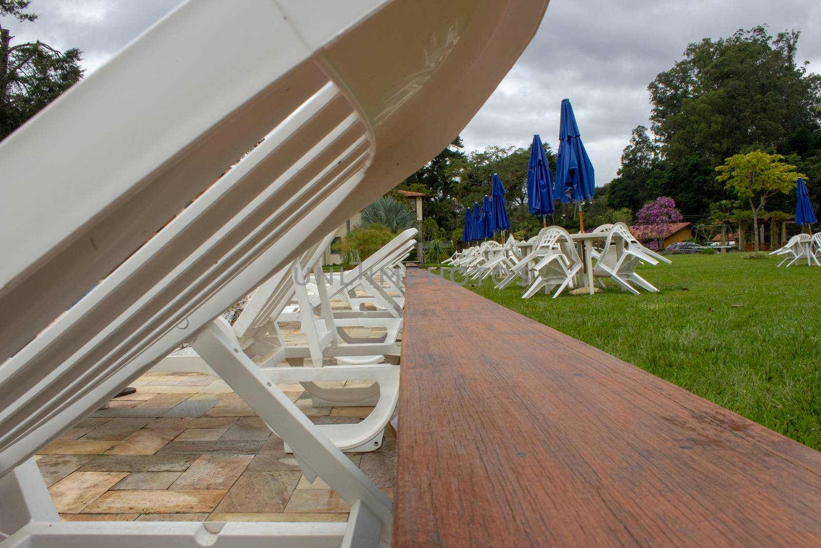 Pool chairs on a resort used for sunbath