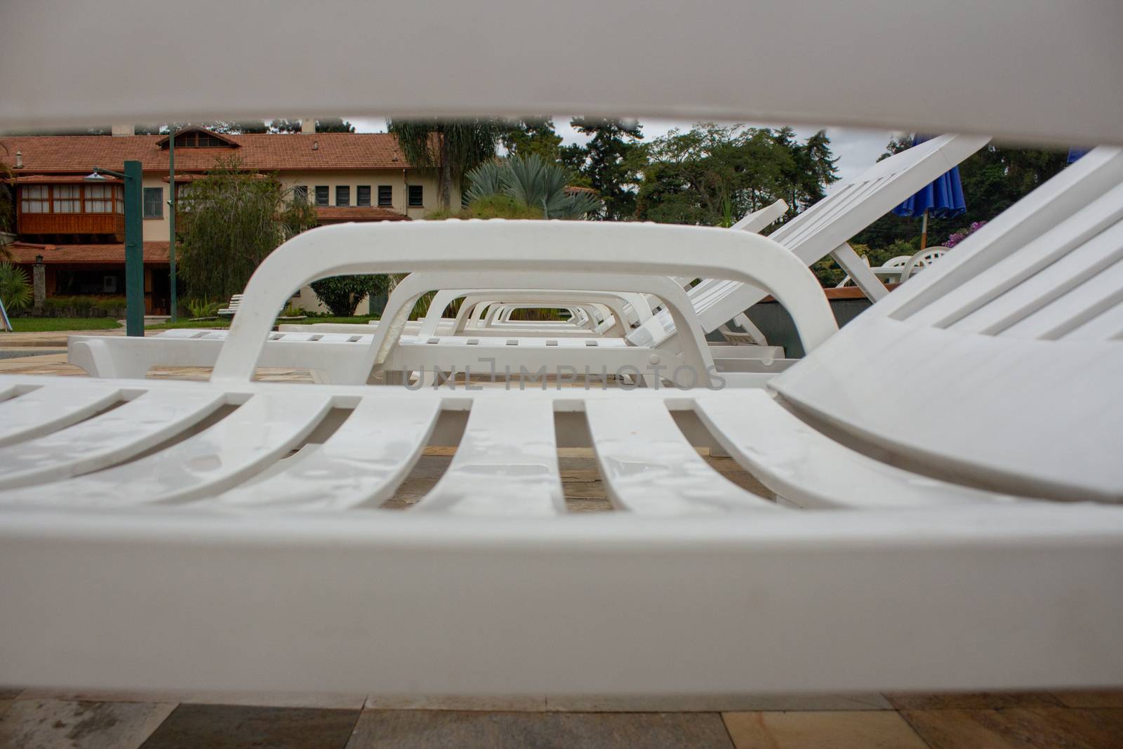 Pool chairs on a resort used for sunbath