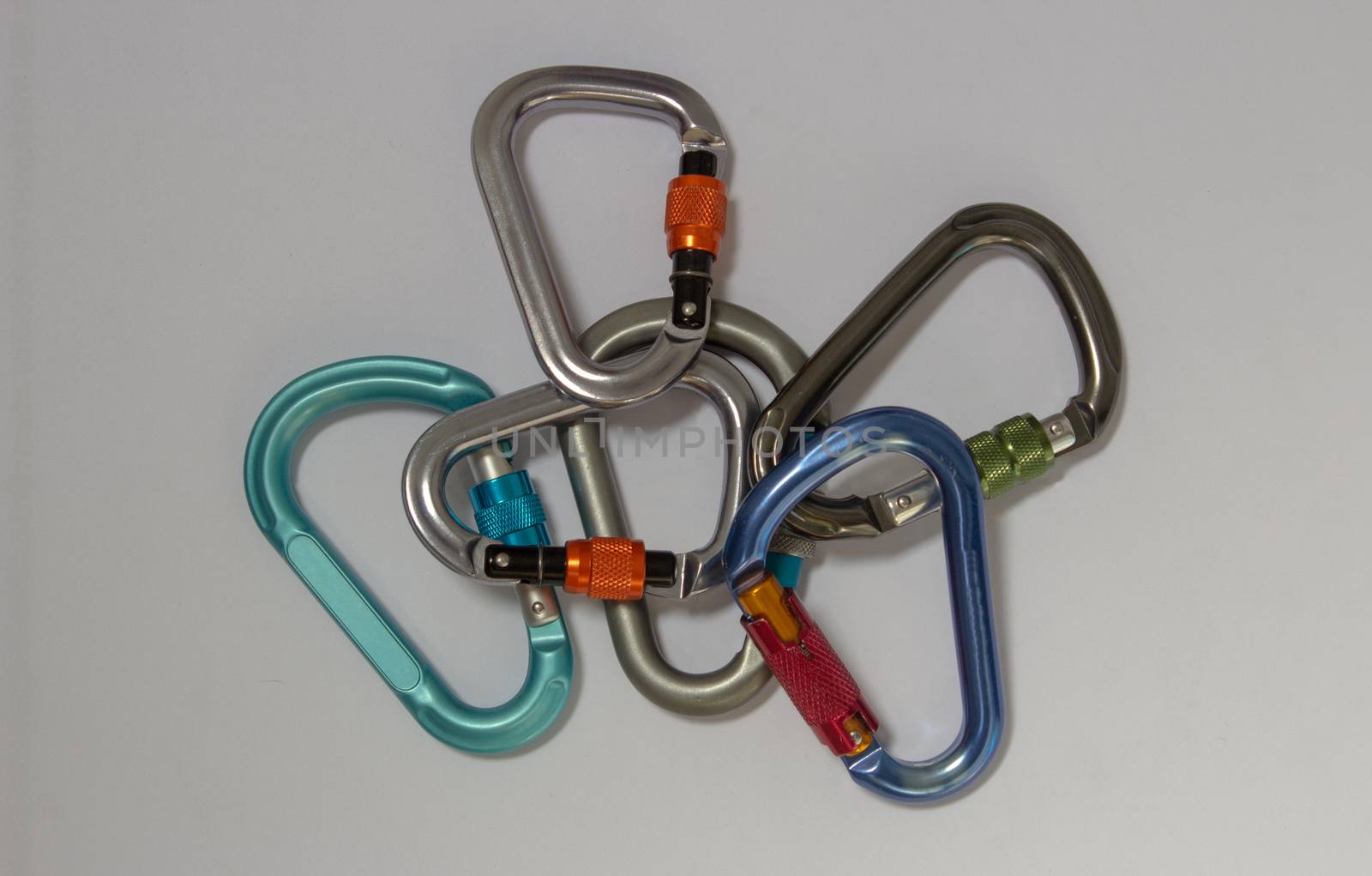 A bunch of carabiners, some screw gate and pear shaped, another automatic locking or D shaped