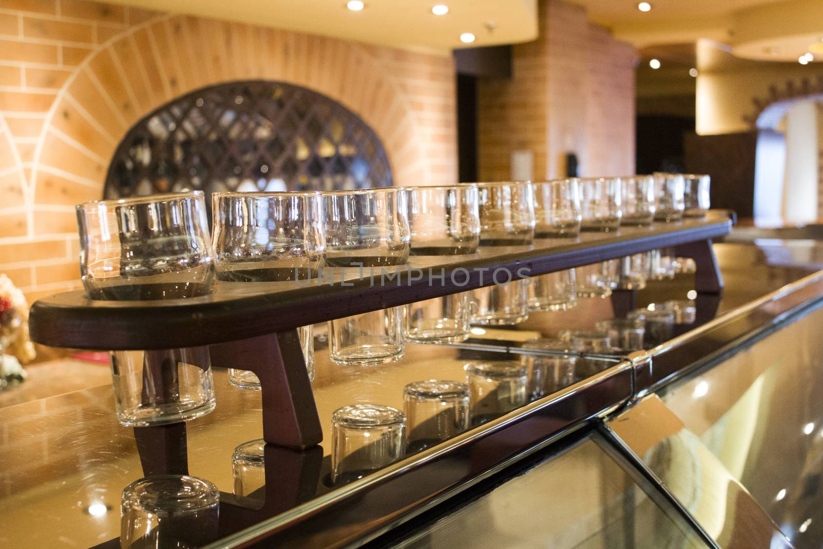 A set of pint glasses on a bar counter