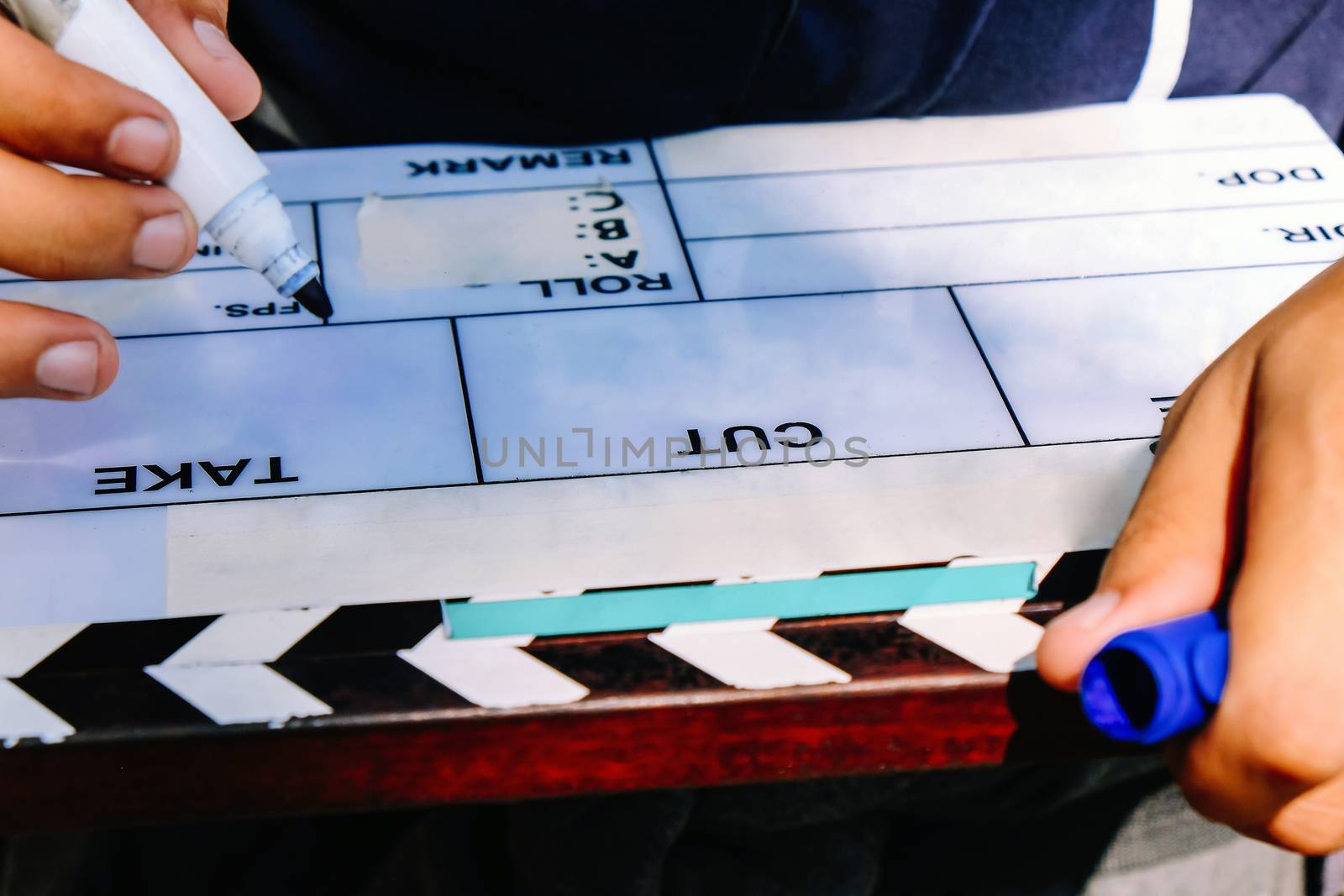 Film Slate, close up image of film production crew holding Film Slate on set