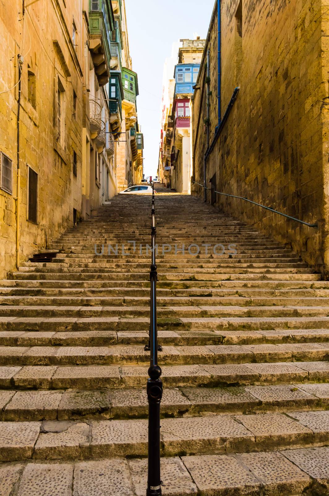 Old stone staircase with iron railing in the old town  by Philou1000