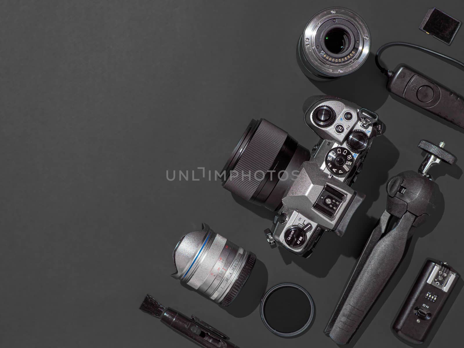Camera and accessories on black, copy space by fascinadora