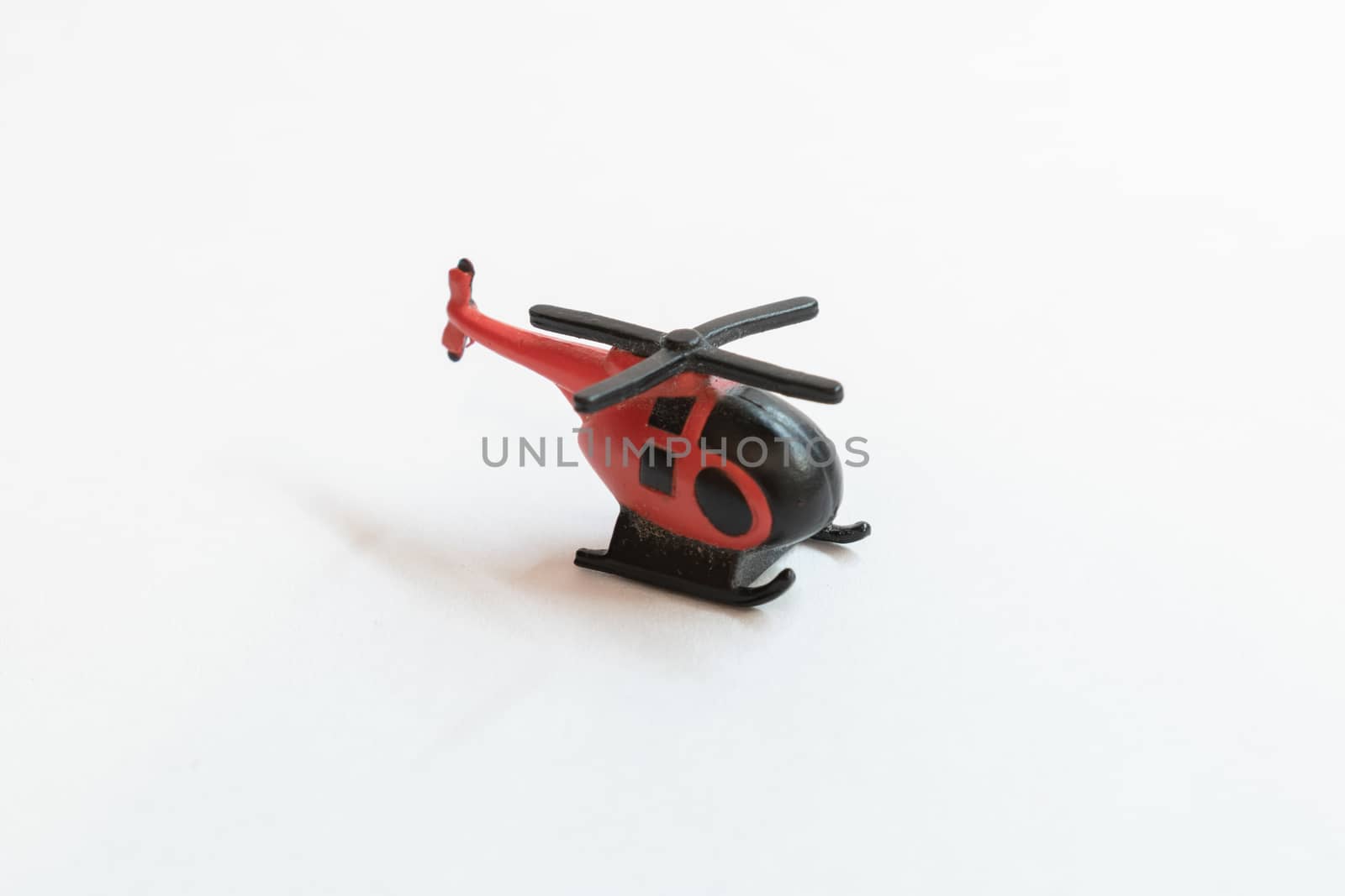 Small colorful helicopter toys isolated on a white background - air travel by helicopter concept.