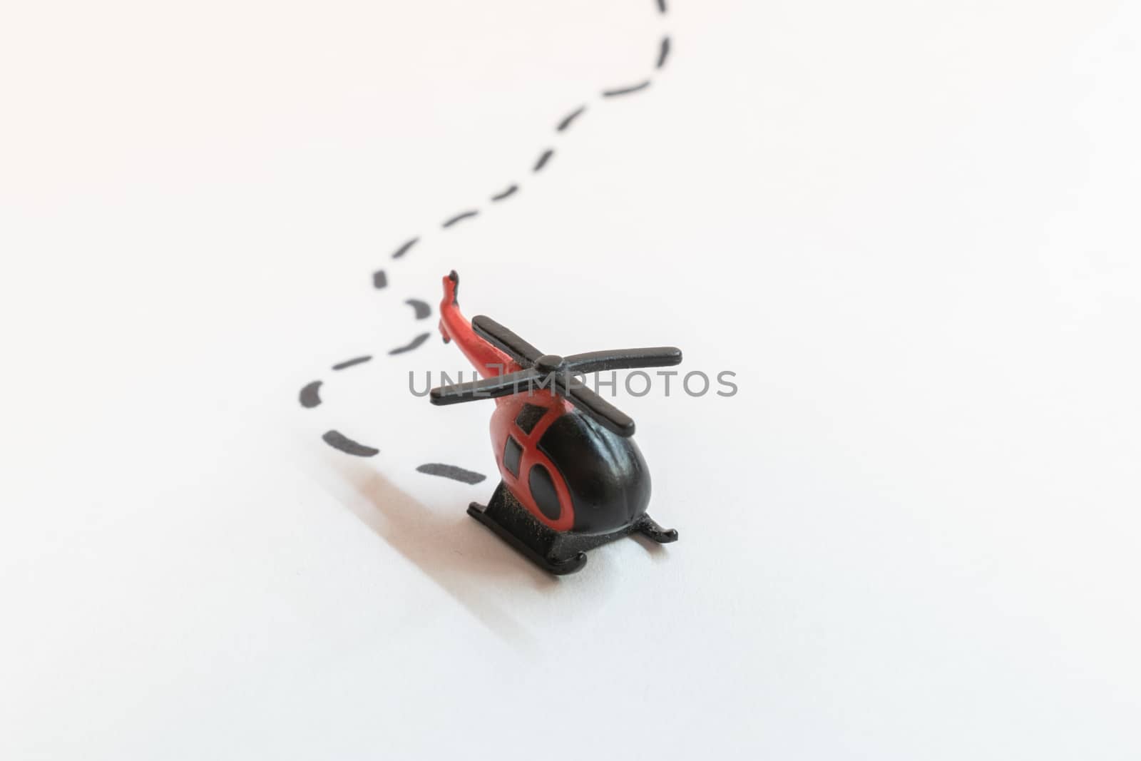 Small colorful helicopter toys isolated on a white background - air travel by helicopter concept.