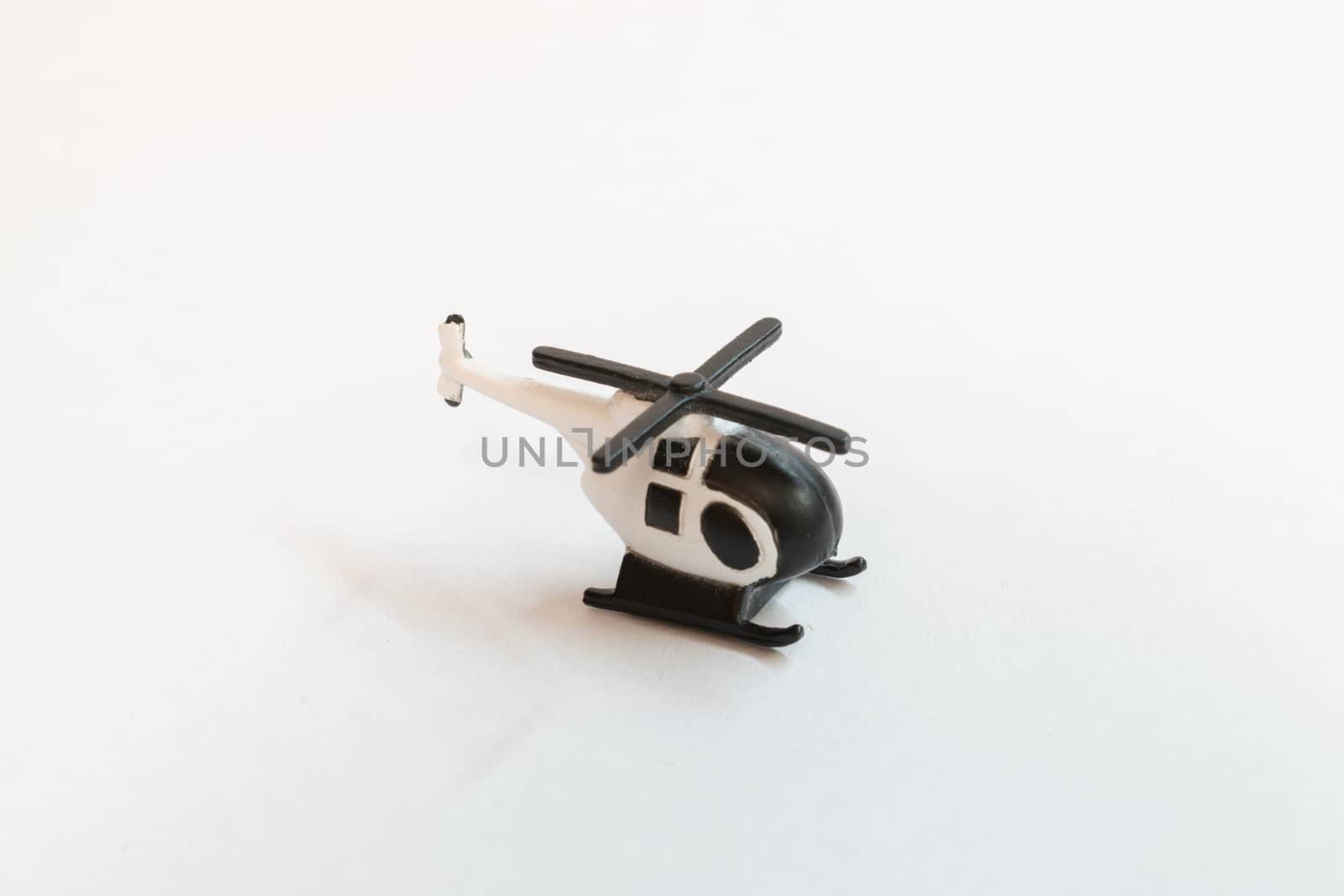 Small colorful helicopter toys isolated on a white background - air travel by helicopter concept.