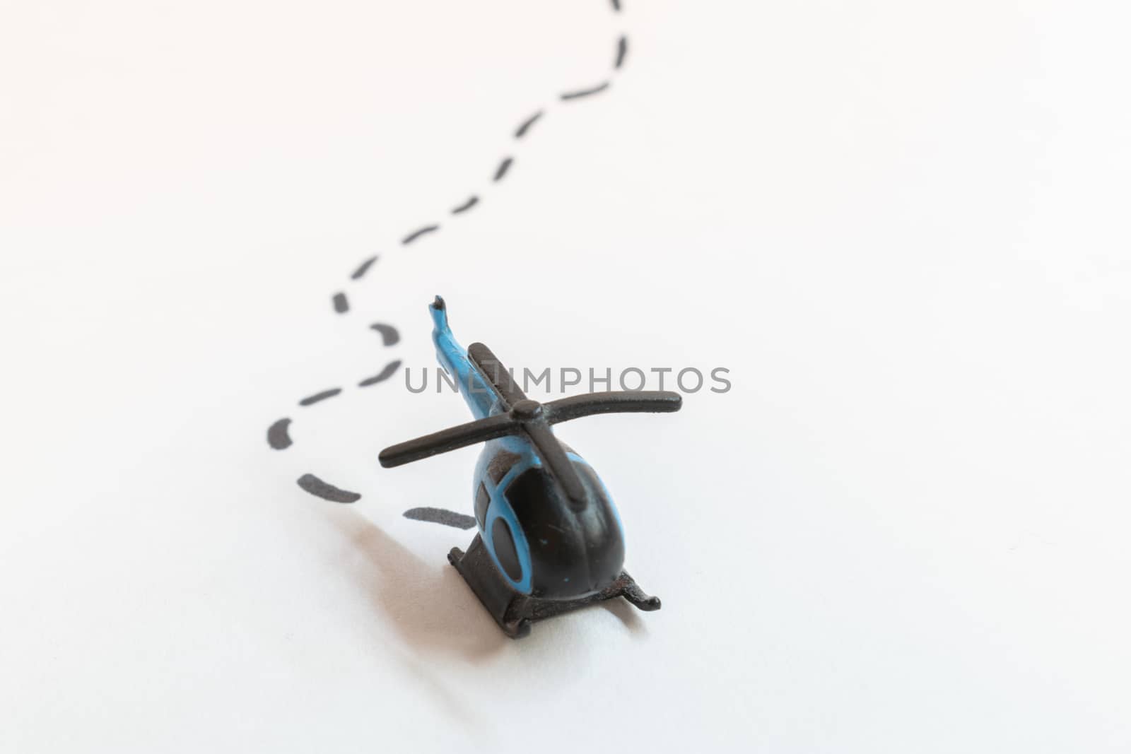 Small colorful helicopter toys isolated on a white background - air travel by helicopter concept.