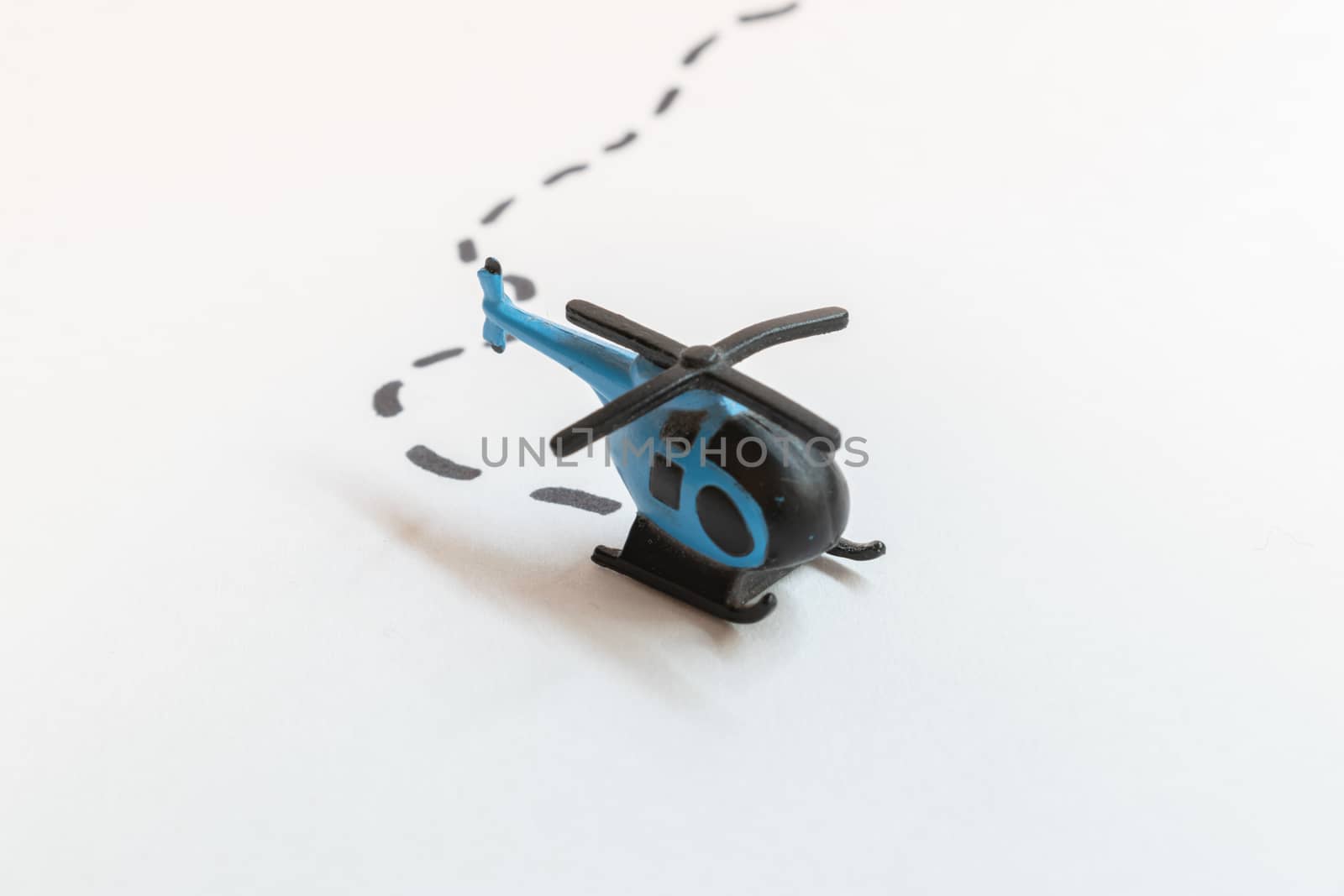 Small colorful helicopter toys isolated on a white background - air travel by helicopter concept.