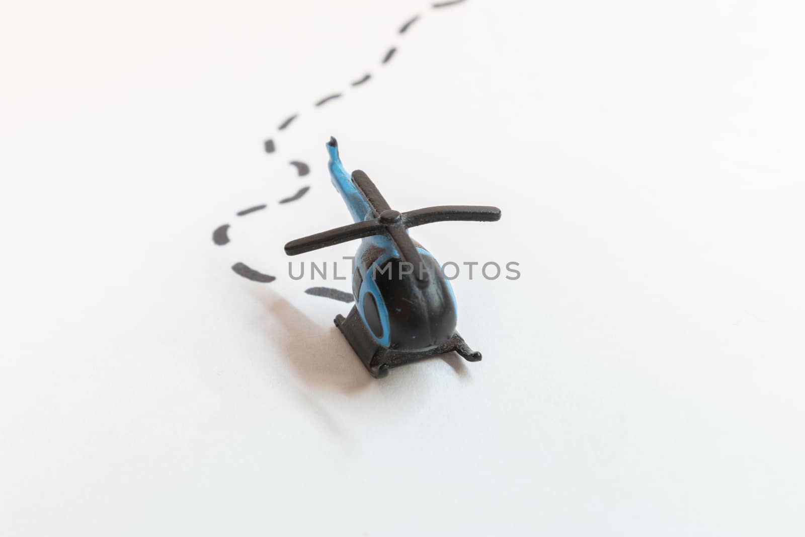 Small colorful helicopter toys isolated on a white background - air travel by helicopter concept.