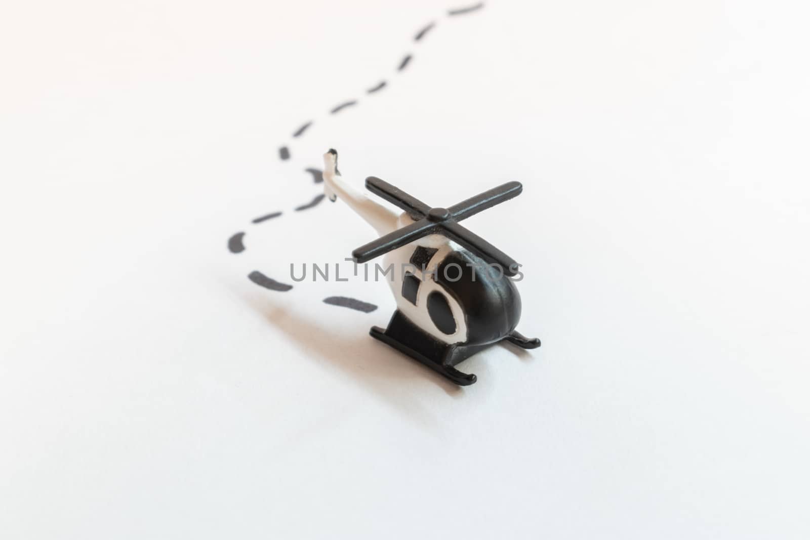 Small colorful helicopter toys isolated on a white background - air travel by helicopter concept.