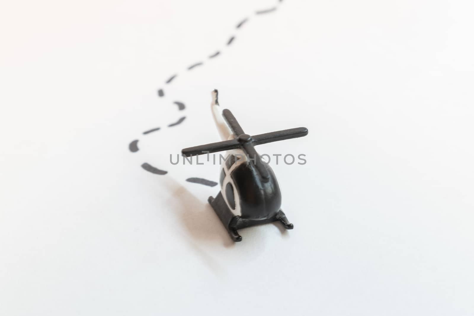 Small colorful helicopter toys isolated on a white background - air travel by helicopter concept.