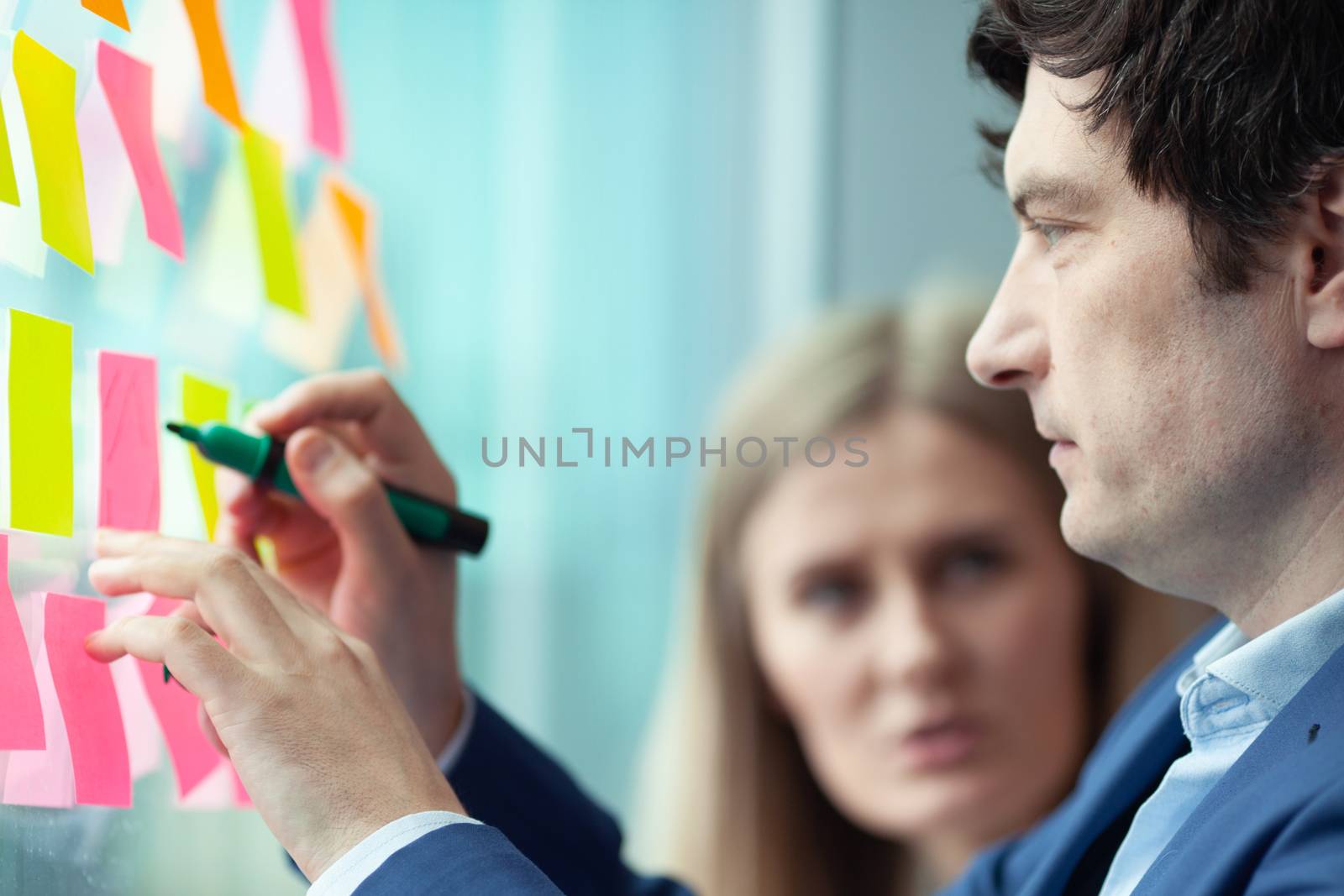 Business people brainstorming ideas by ALotOfPeople