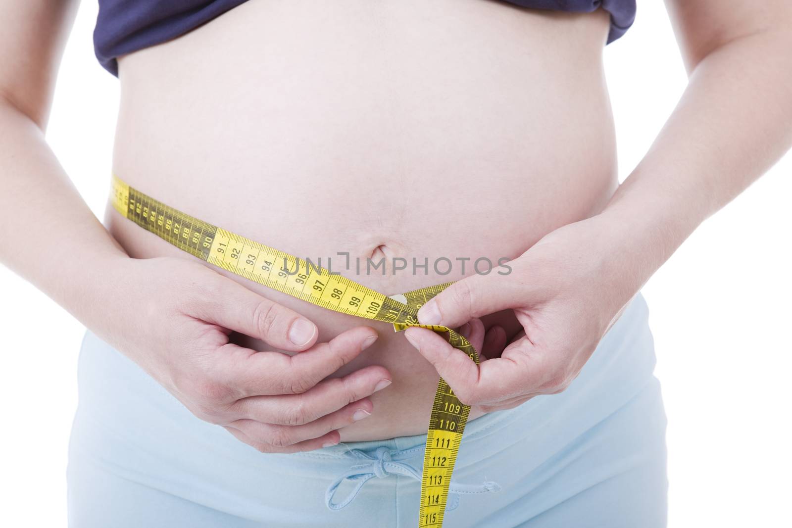 Closeup of pregnant woman at white background