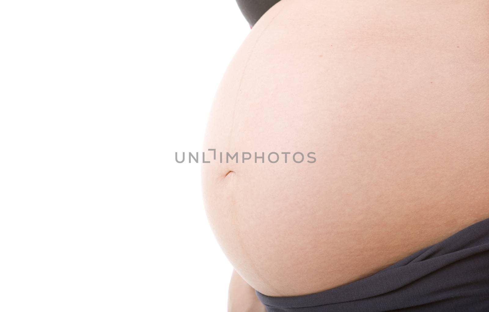 Closeup of pregnant woman at white background