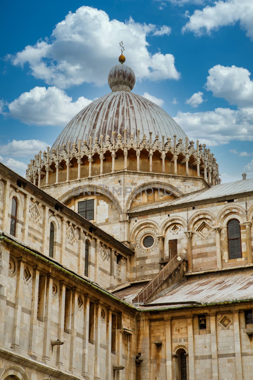 An ancient, ornately decorated, domed church in Pisa, Italy