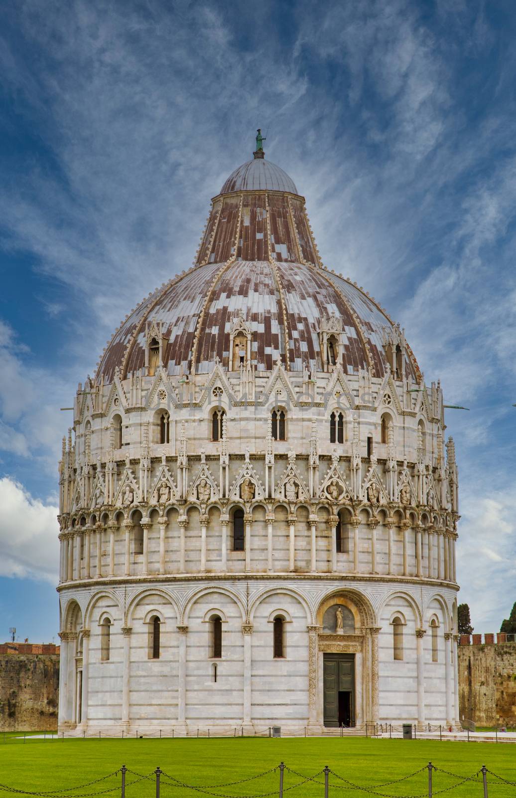 An ancient, ornately decorated, domed church in Pisa, Italy