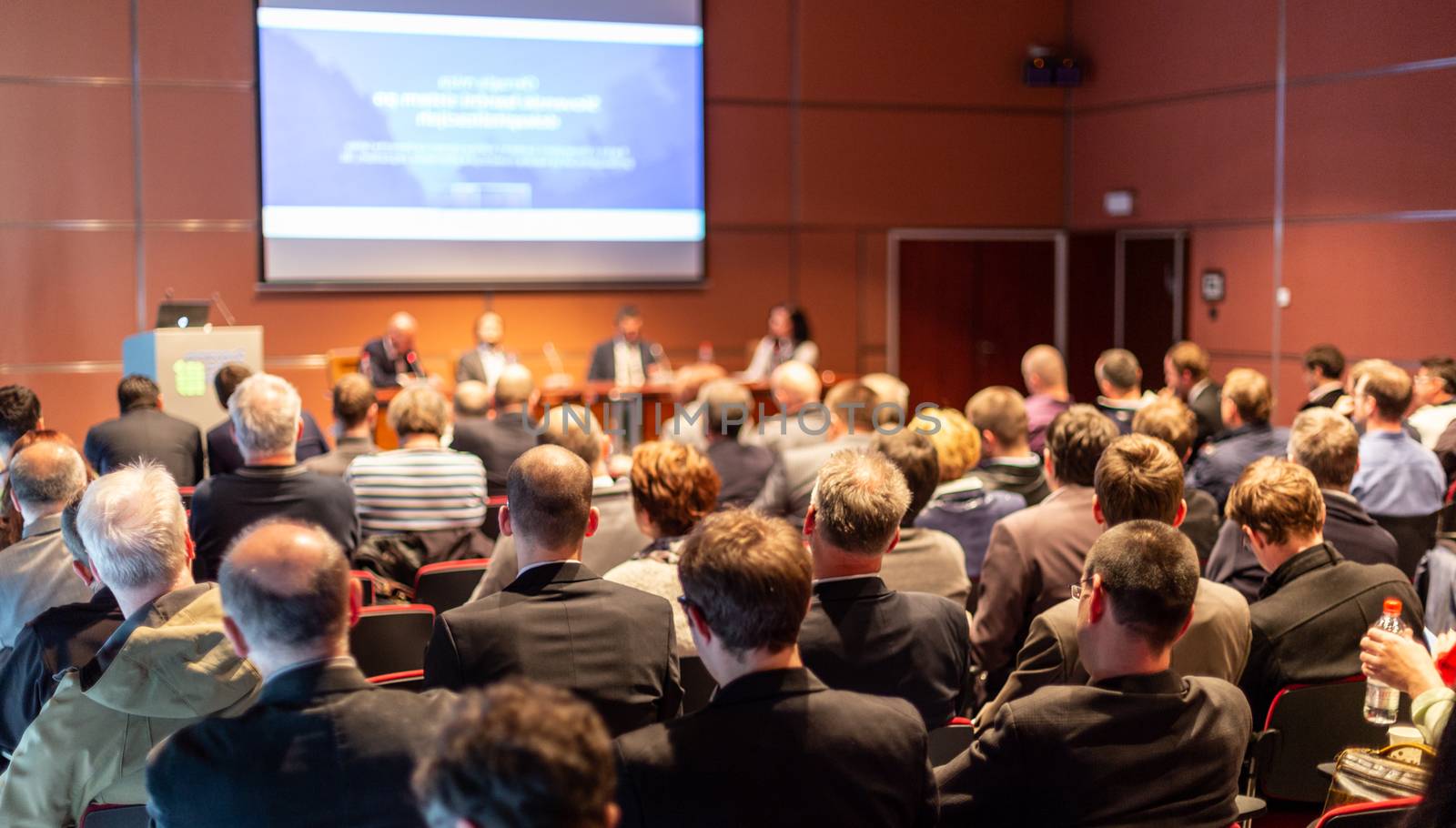 Round table discussion at business convention and presentation. Audience at the conference hall. Business and entrepreneurship symposium.