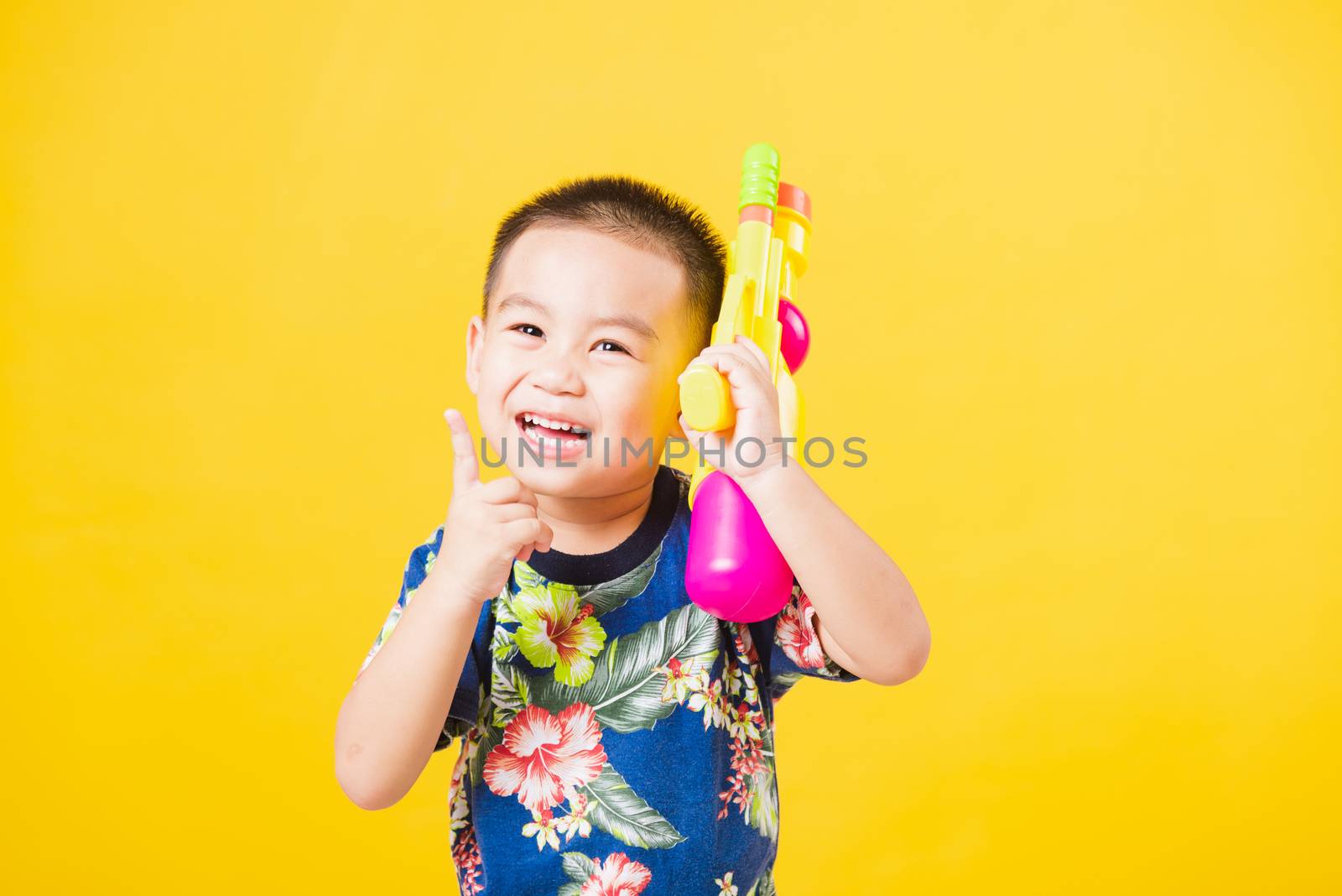 little children boy so happy in Songkran festival day holding wa by Sorapop