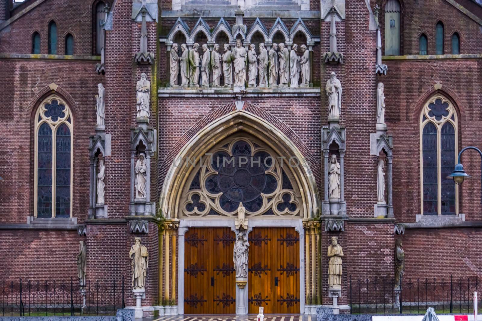 the entrance of the Saint Lambertus church in Veghel city, The Netherlands, popular medieval architecture by pierre cuypers by charlottebleijenberg