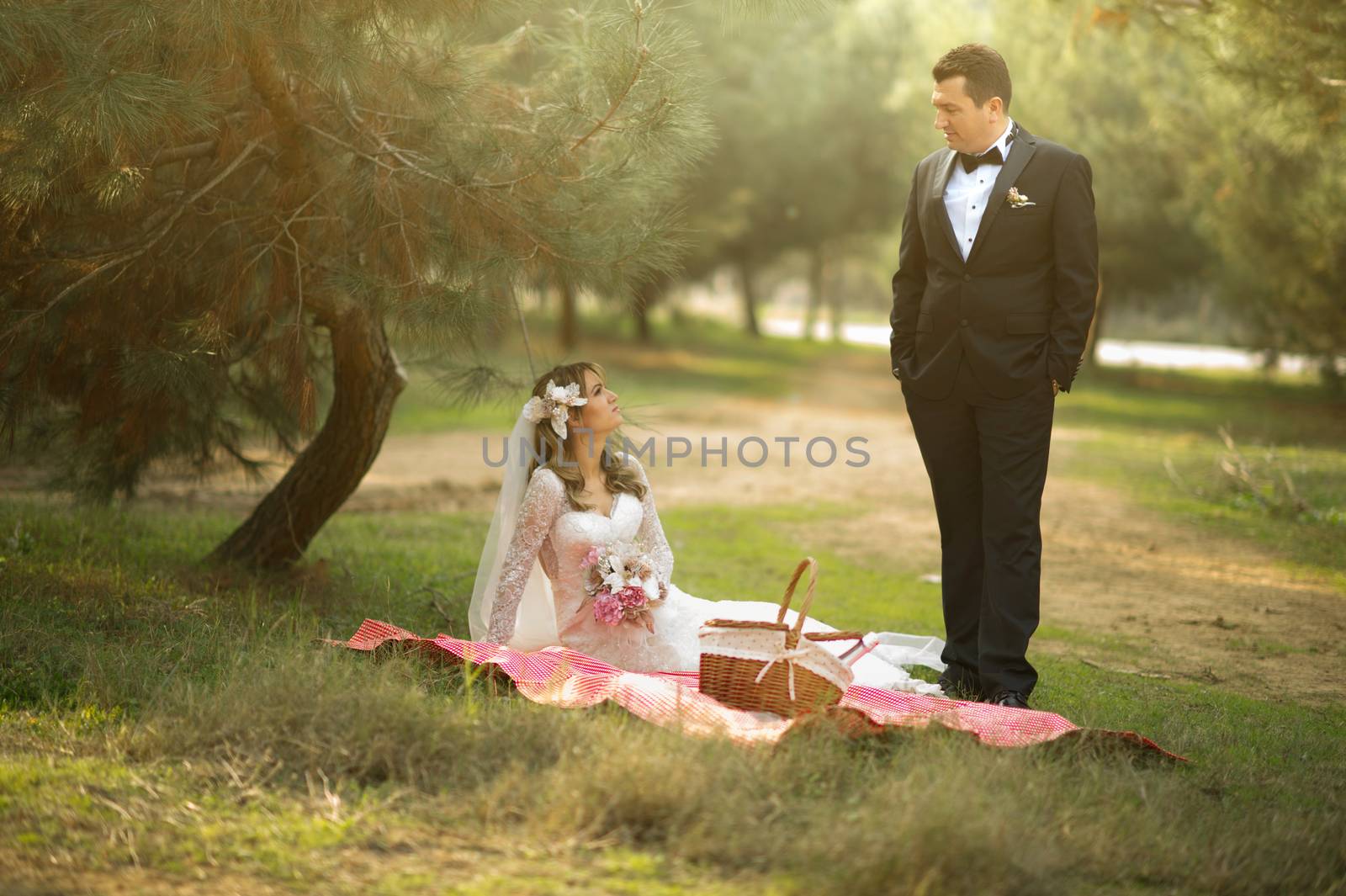 Young bride and groom in wedding dress and suit getting married