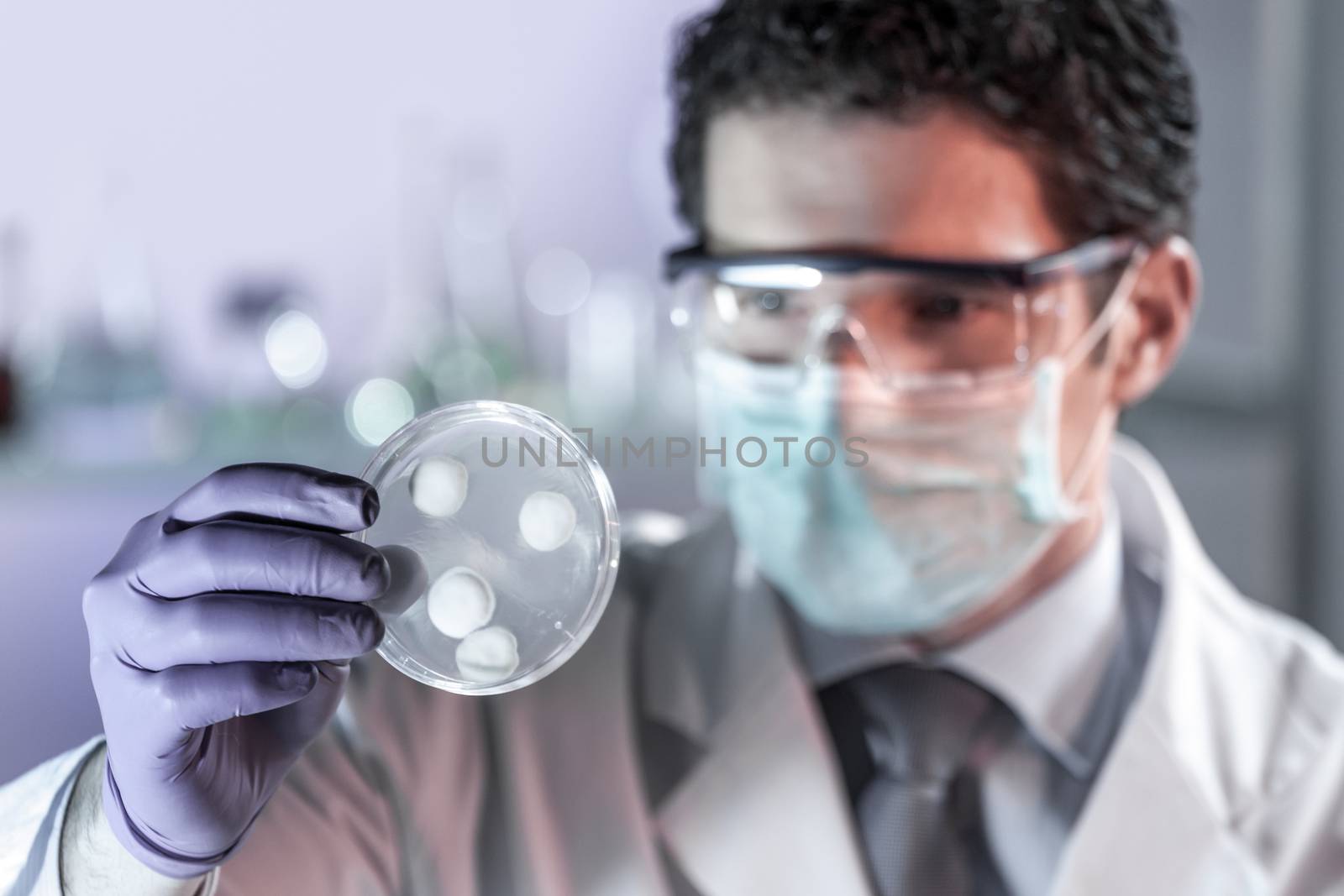 Scientist working in corona virus vaccine development laboratory research facility. by kasto