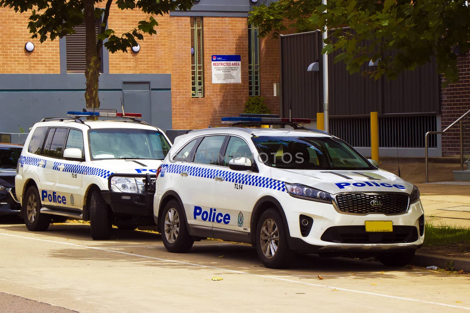 Police cars parked outside Police station by definitearts