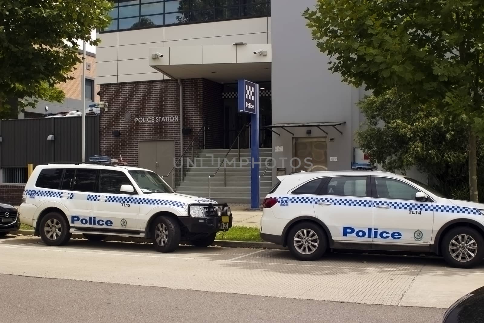 Two Police vehicles outside a local Police Station by definitearts