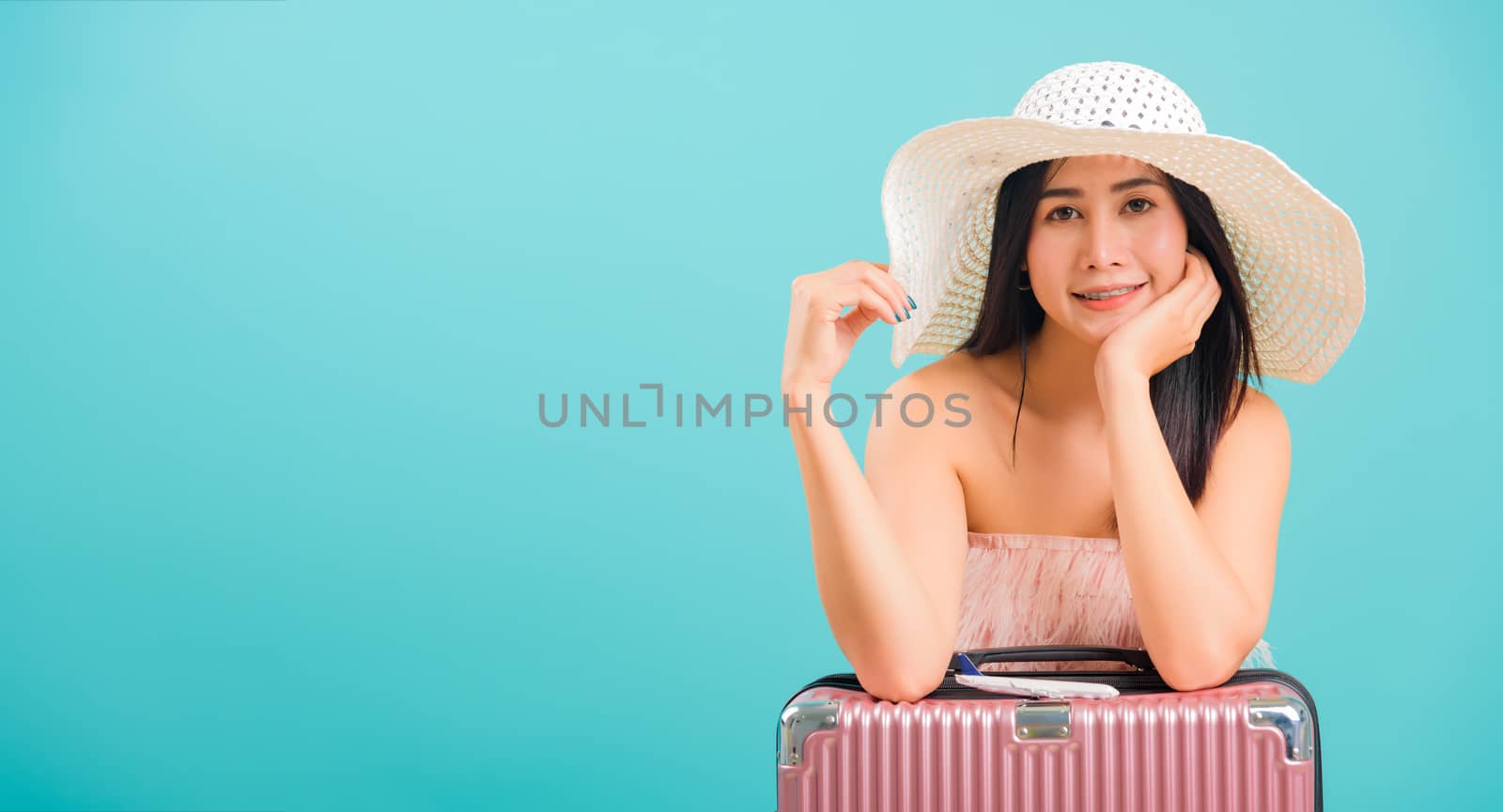 Portrait asian beautiful woman with hat her sitting with travel  by Sorapop