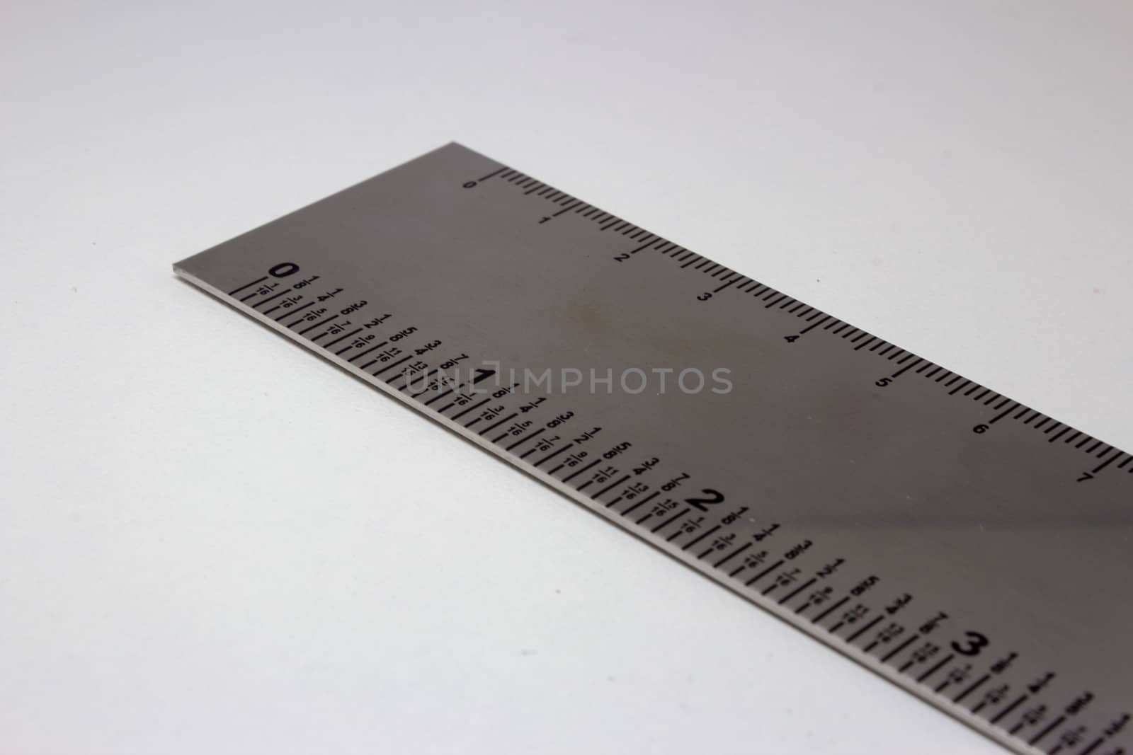 Metal ruler with measures in centimeter and inches