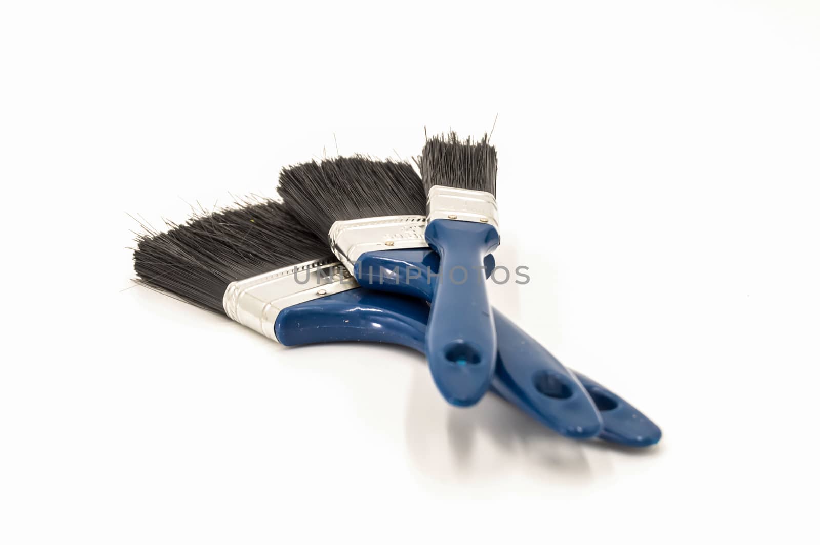 Three paint brushes with blue colored handles  by Philou1000