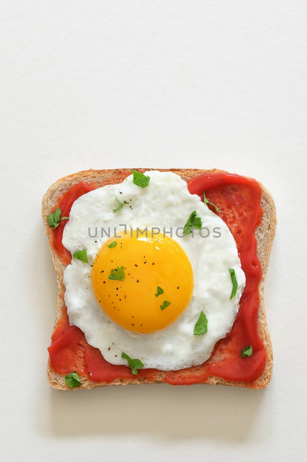 Fried Egg On Slice Of Toast Isolated