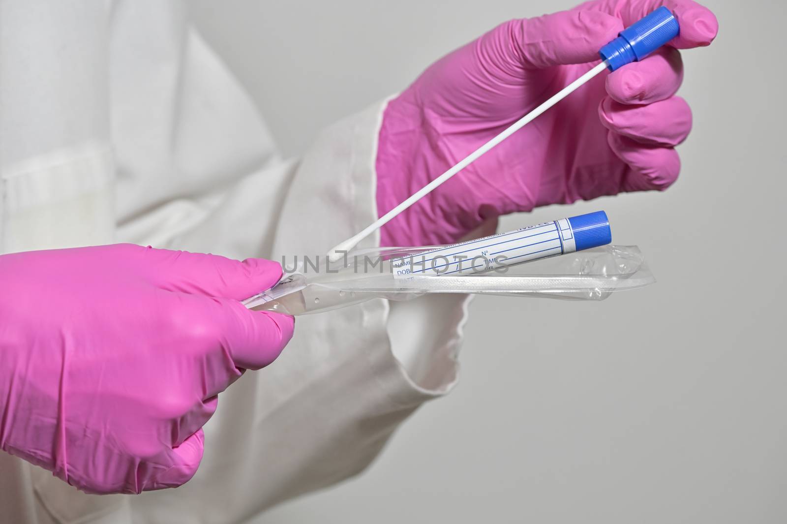Nurse Holds A Swab For The Coronavirus Test by mady70