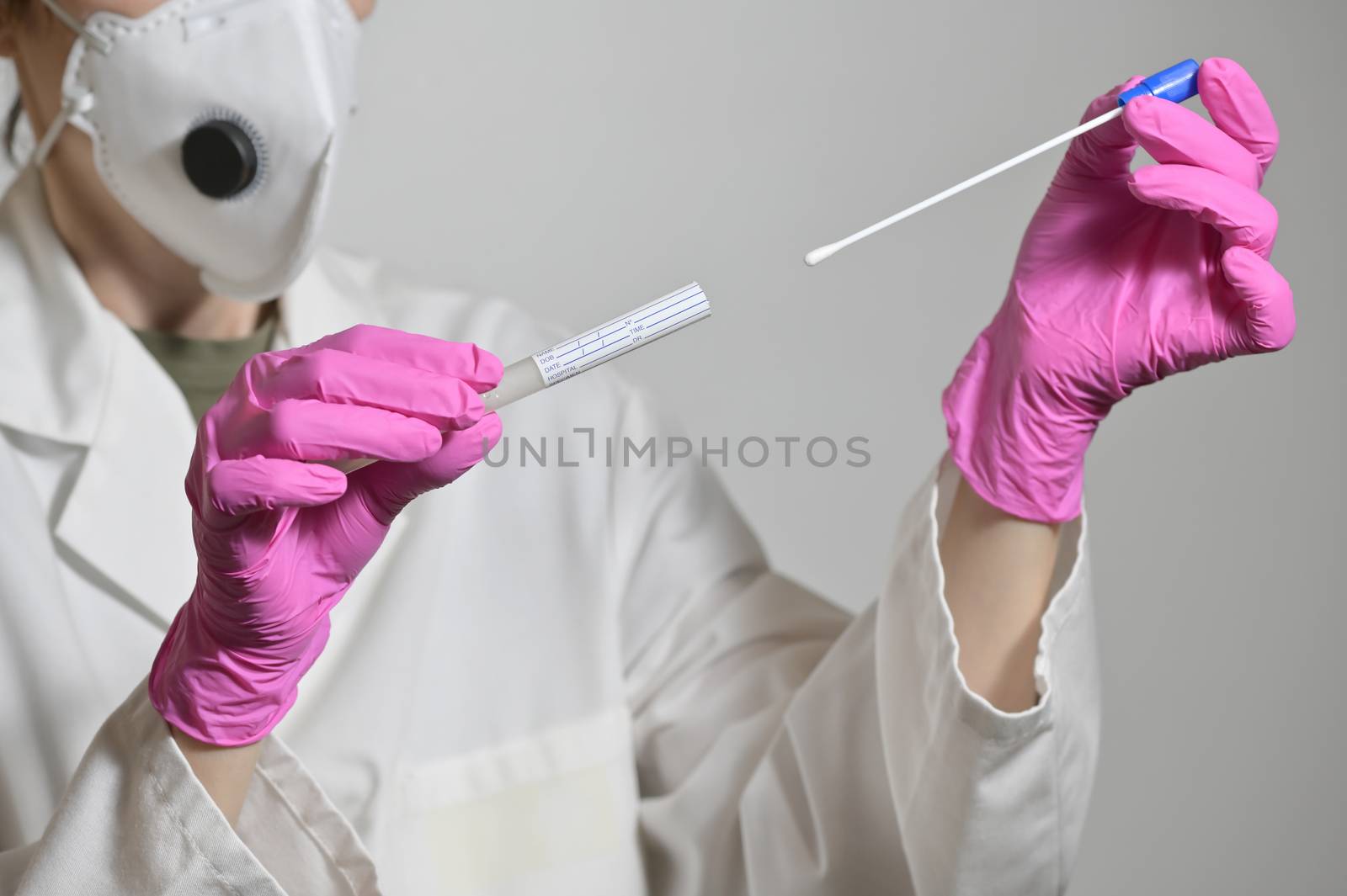 Nurse Holds A Swab For The Coronavirus Test by mady70