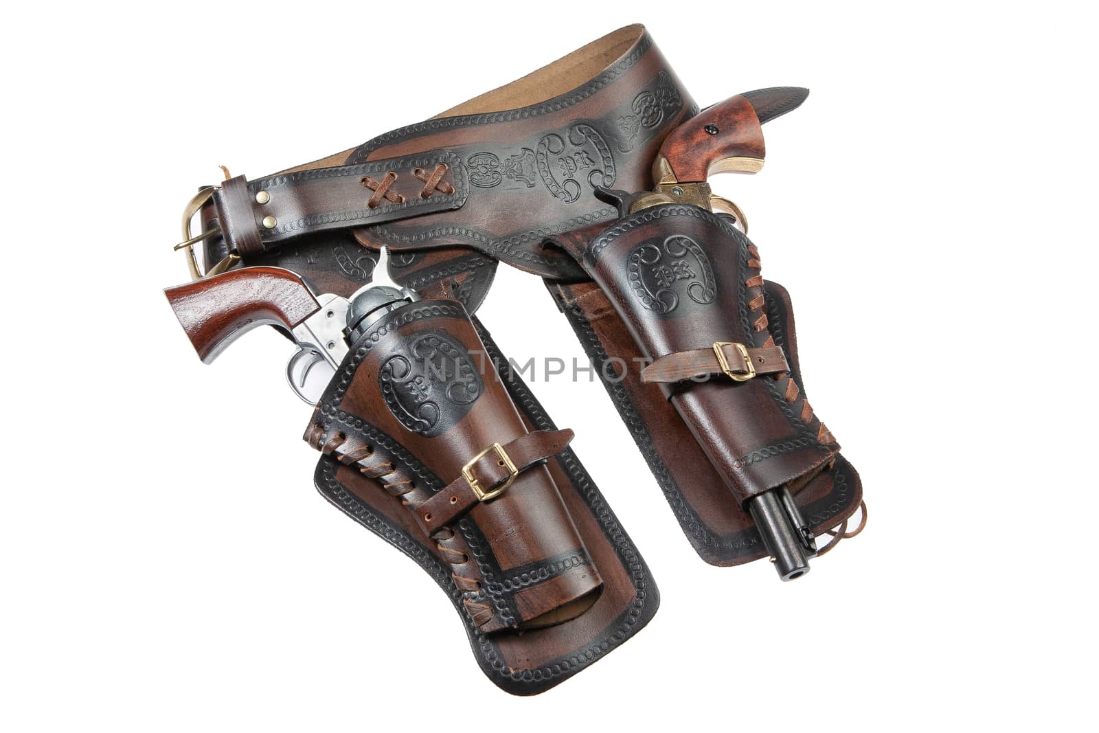 Leather cowboy holster and revolver on an isolated studio background