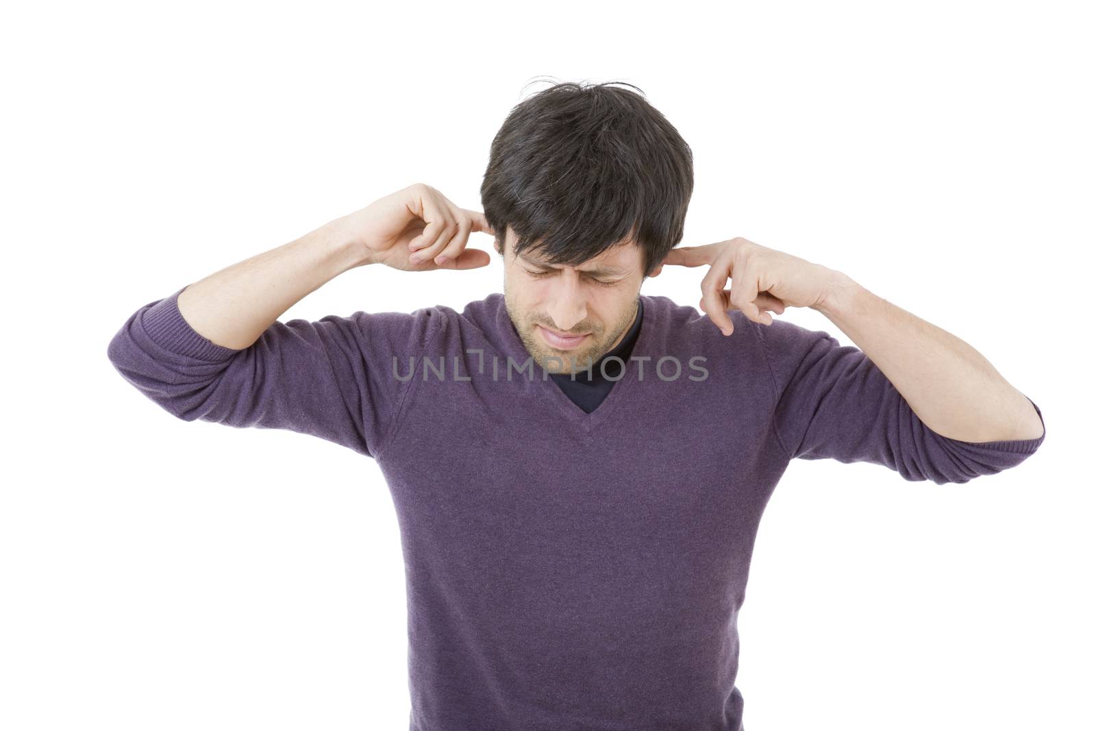 handsome young man covering his ears, isolated white background